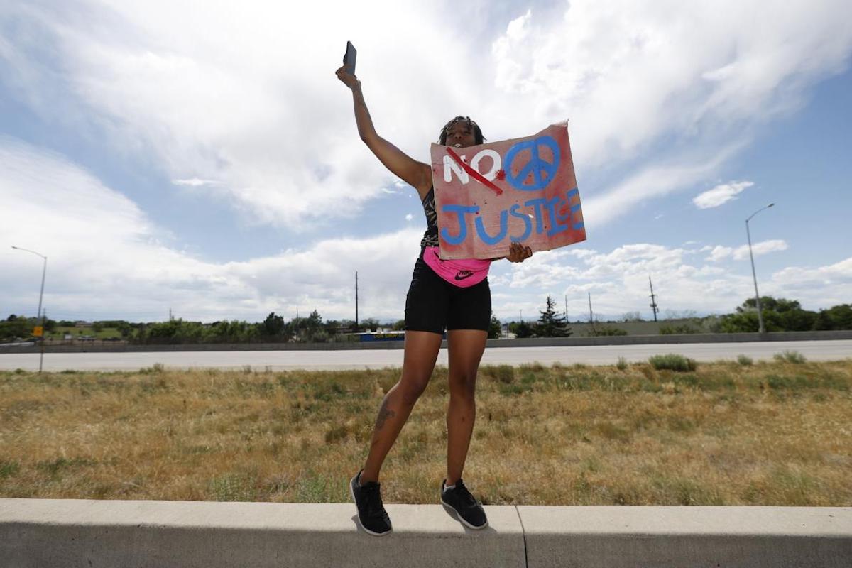 Colorado cops on paid leave after photos taken at Elijah McClain memorial | TheGrio